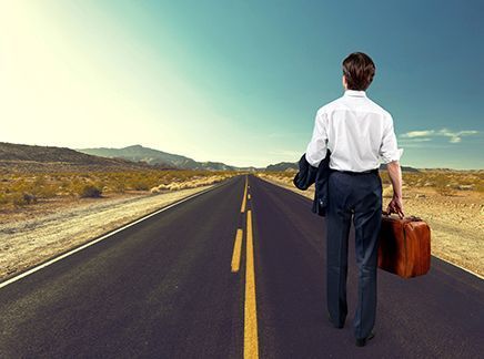 Man walking on road searching for job or career.